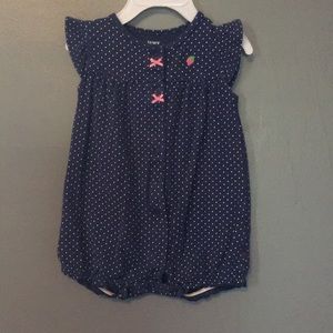 Navy snap-up romper with strawberry on back